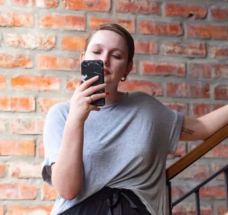 Female Browsing Phone Portrait