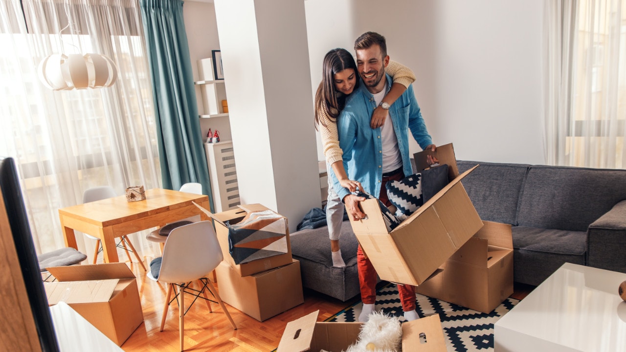 young couple moving into a new appartment